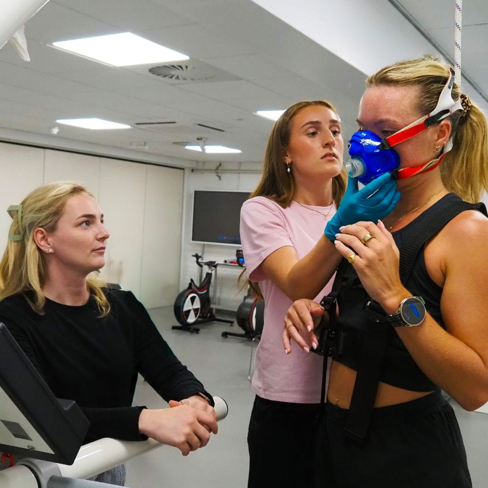 Scientist fit an oxygen mask on endurance record-breaker Imo Boddy in a lab