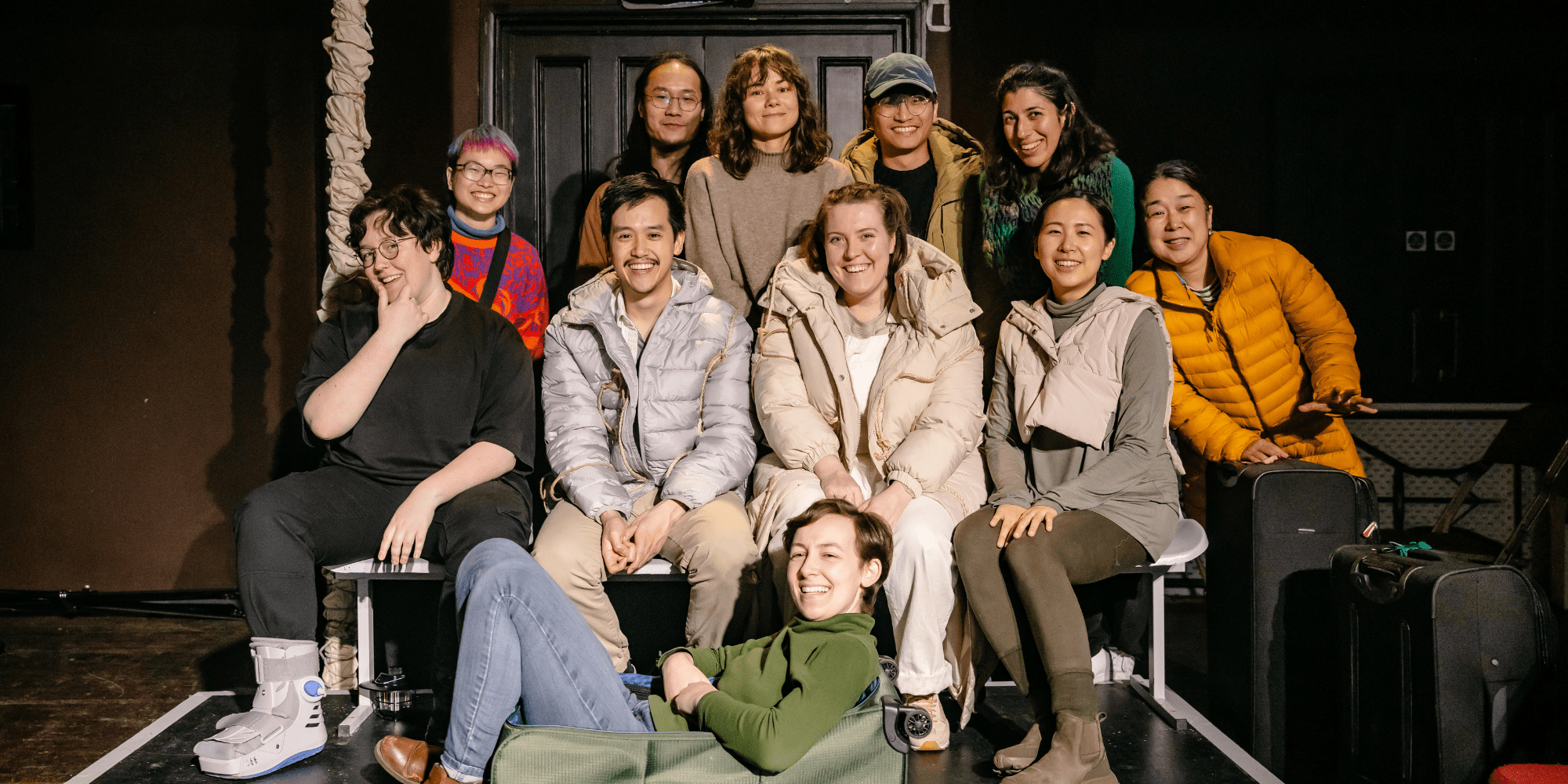 Halfpace Theatre Transit cast sat together on stage