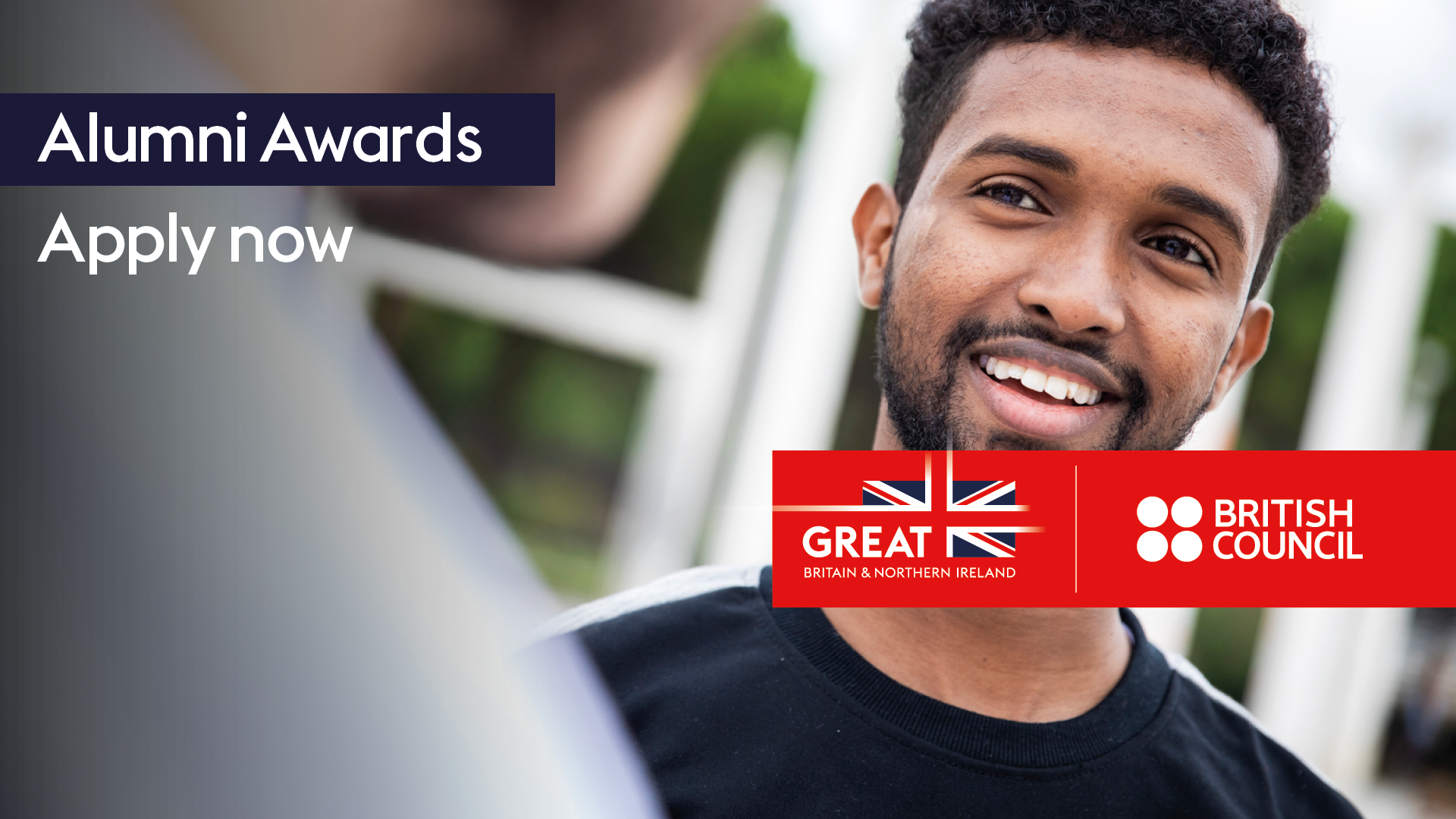 An image of a man smiling with the words Alumni Awards, Apply now over the top with the British Council logo.